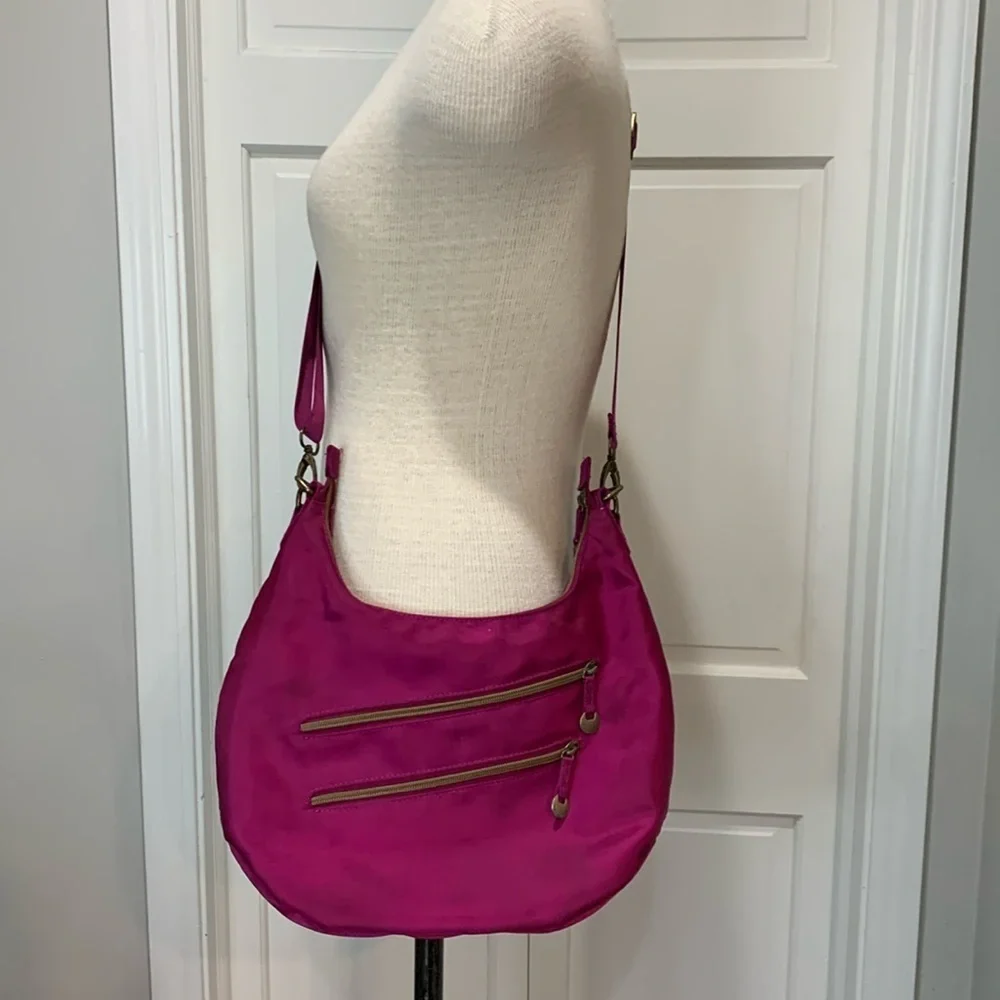 Travelon magenta cloth purse withh adjustable strap